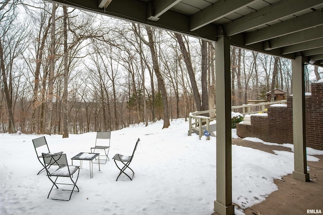 view of yard layered in snow