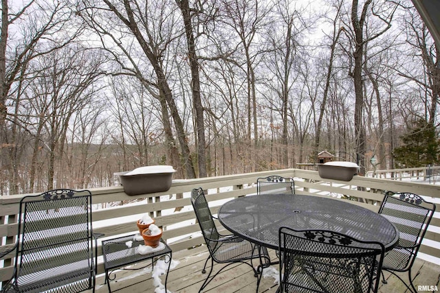 wooden terrace with outdoor dining space