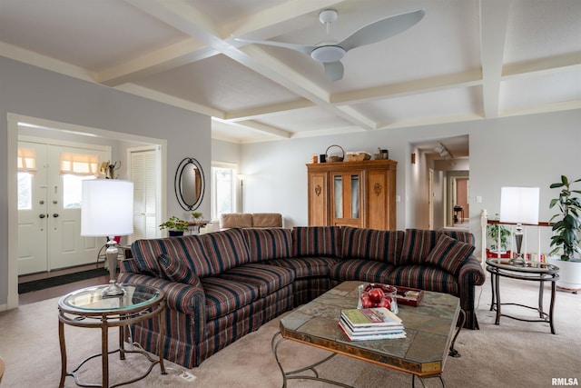 carpeted living room featuring coffered ceiling, a wealth of natural light, and beamed ceiling