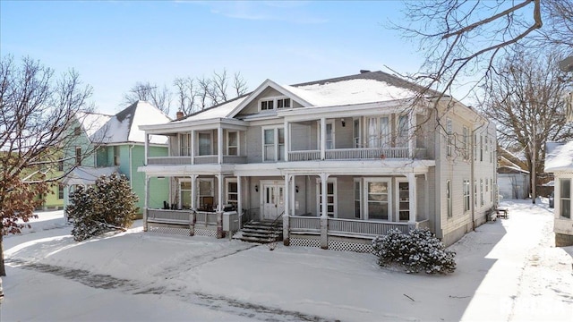 view of front of home with covered porch and a balcony