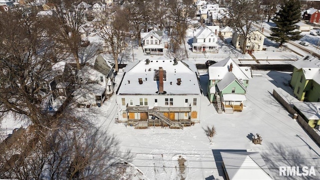 snowy aerial view featuring a residential view