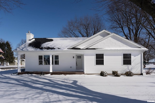 view of front of property featuring a chimney