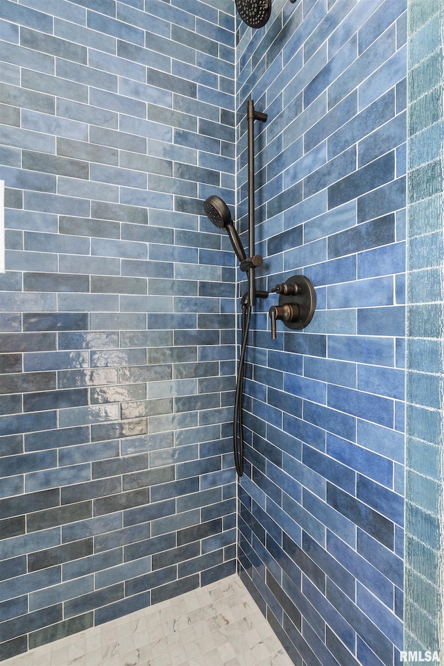 full bathroom with a tile shower