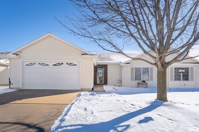 ranch-style house featuring an attached garage