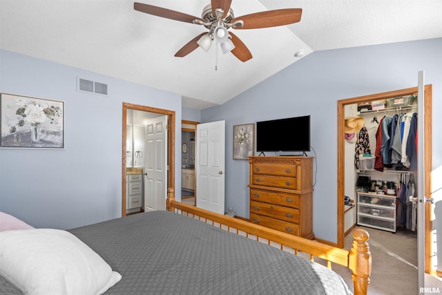 bedroom featuring carpet floors, lofted ceiling, a closet, visible vents, and a ceiling fan