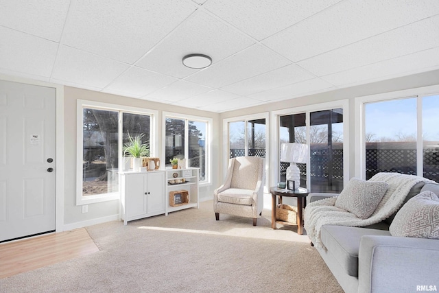 sunroom / solarium with a wealth of natural light and a paneled ceiling