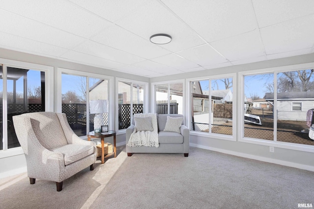 sunroom featuring a drop ceiling