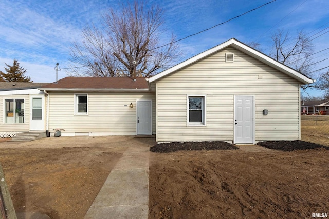 rear view of property featuring entry steps