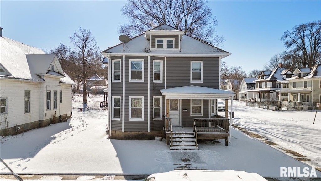 traditional style home featuring a residential view and a porch