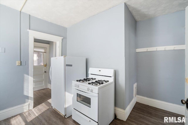 kitchen with white appliances, baseboards, dark wood finished floors, and light countertops