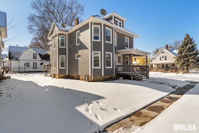 traditional style home featuring covered porch