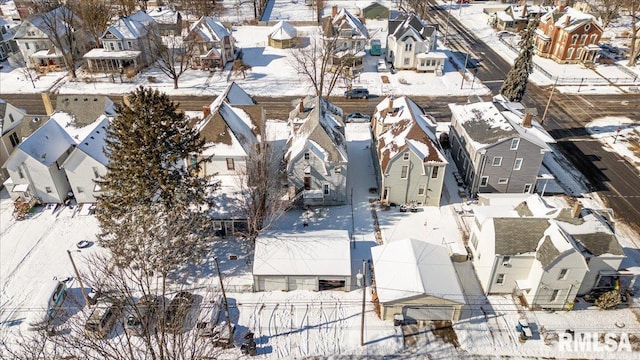 snowy aerial view with a residential view