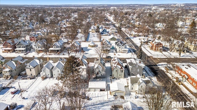 snowy aerial view featuring a residential view