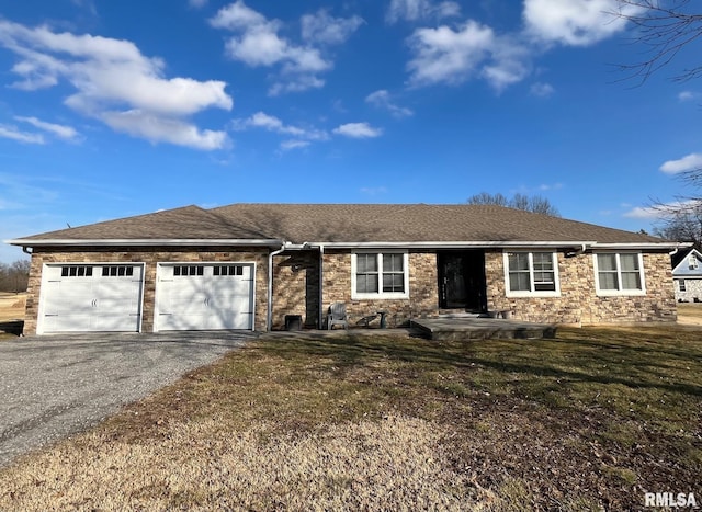 single story home with an attached garage, driveway, a shingled roof, and a front yard