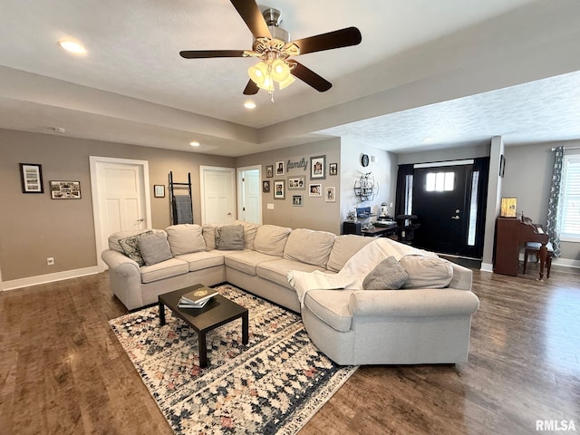 living area with ceiling fan, baseboards, dark wood-style flooring, and recessed lighting