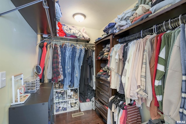 walk in closet featuring dark wood-type flooring