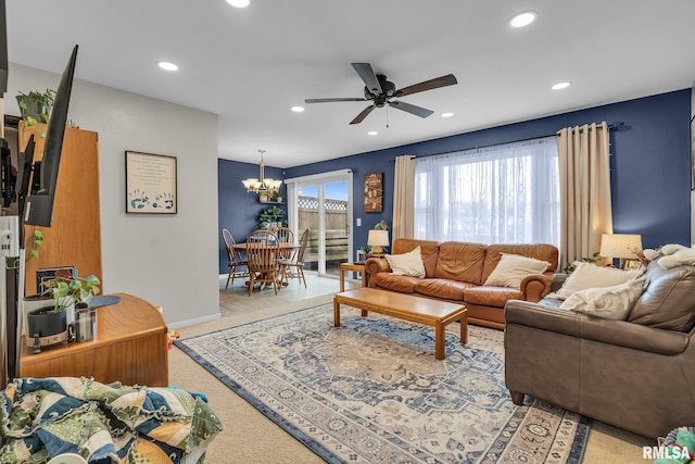 living room with recessed lighting, light colored carpet, baseboards, and ceiling fan with notable chandelier