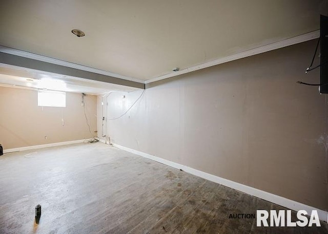 below grade area with wood finished floors and baseboards