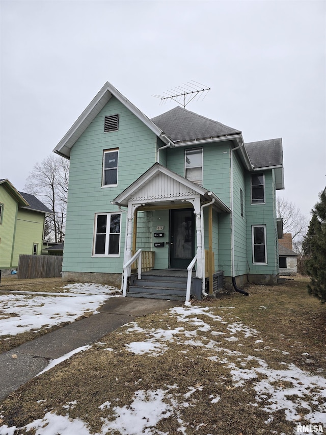 view of front of home featuring a shingled roof and entry steps