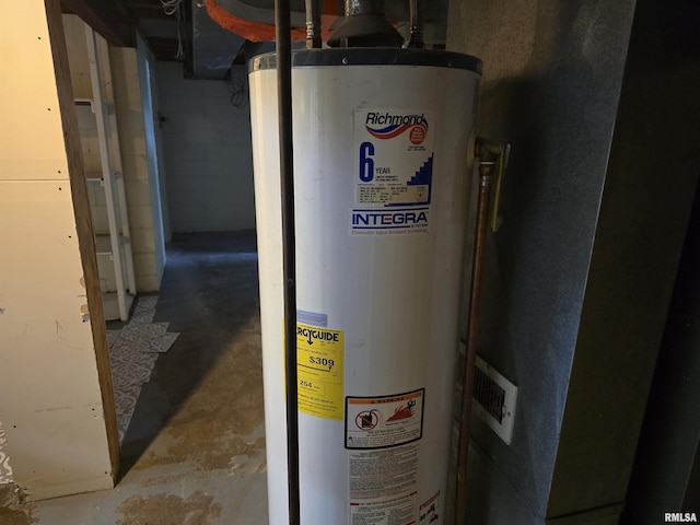 utility room featuring water heater