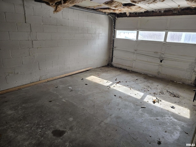 garage with concrete block wall