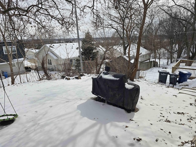 yard layered in snow featuring fence