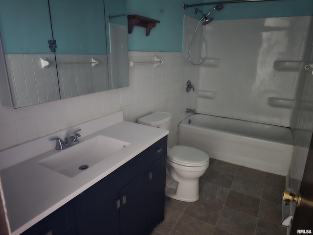 full bath with  shower combination, vanity, toilet, and tile walls