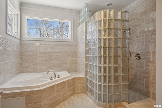 bathroom featuring a garden tub and a walk in shower