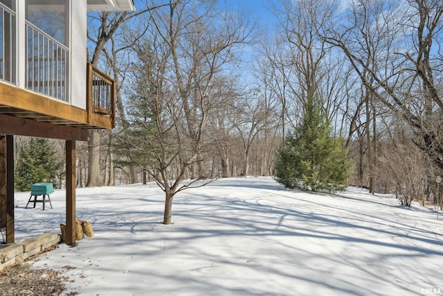 view of yard layered in snow