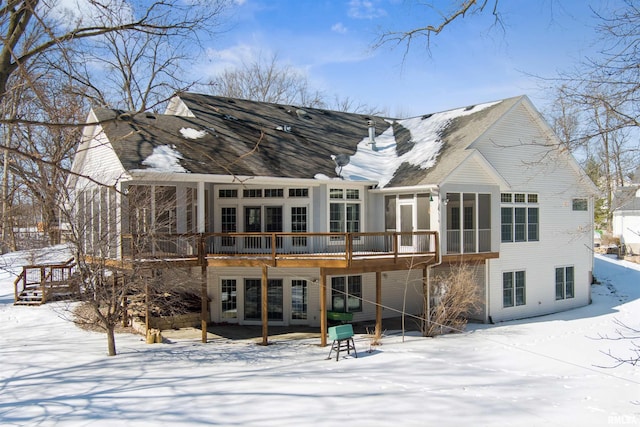 snow covered property featuring a deck