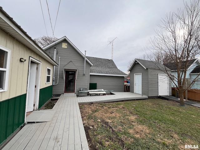 exterior space featuring a storage unit, a lawn, and an outdoor structure