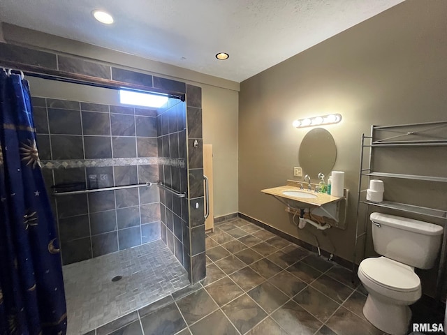 bathroom with toilet, a stall shower, tile patterned flooring, and baseboards