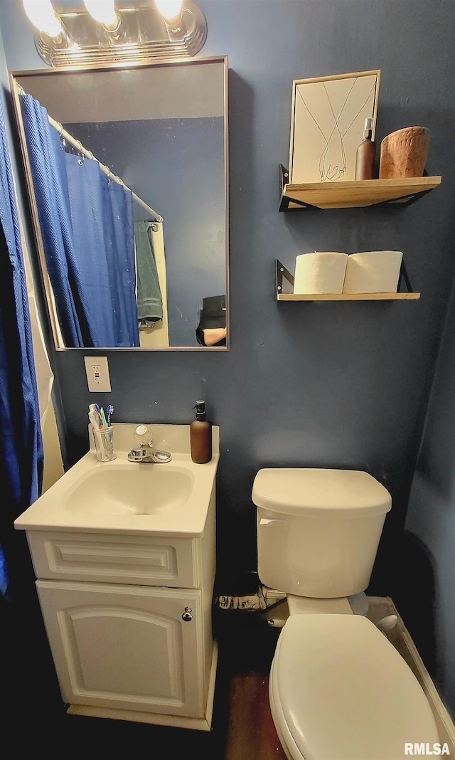 full bathroom with vanity and toilet