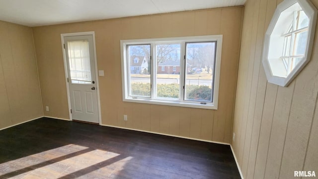 interior space featuring dark wood-type flooring and baseboards