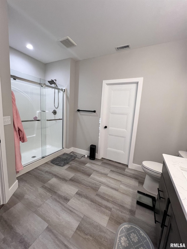 full bathroom with a stall shower, visible vents, and baseboards