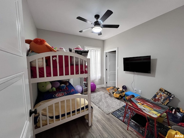 bedroom with ceiling fan and wood finished floors