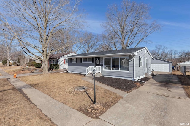 view of front of house featuring a garage and an outdoor structure