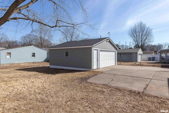 detached garage with fence