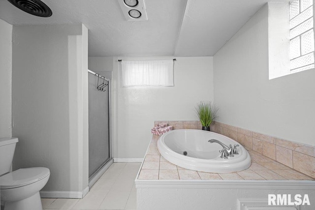 bathroom with toilet, a stall shower, tile patterned flooring, baseboards, and a bath