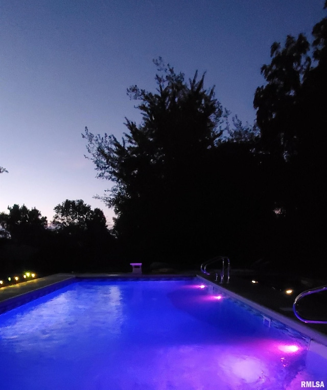 view of swimming pool featuring a water slide