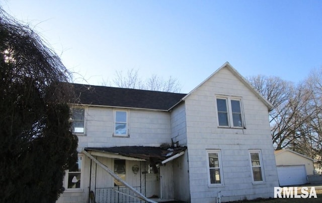 view of front of home with an outbuilding and a detached garage