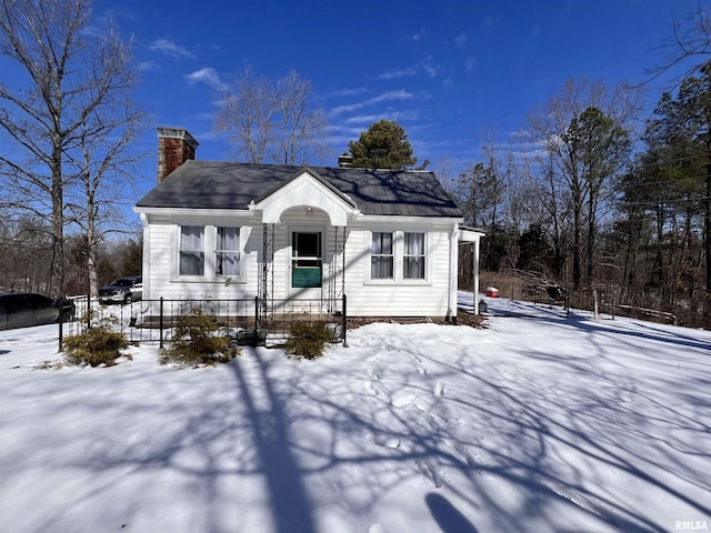 view of front of home with a chimney