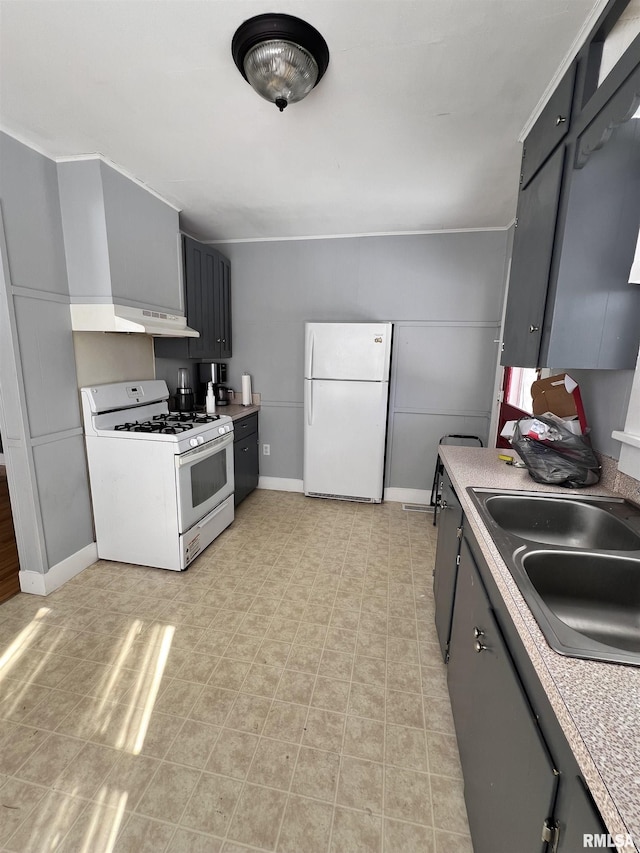 kitchen with white appliances, a sink, baseboards, light countertops, and gray cabinets