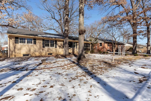 ranch-style house with fence and brick siding