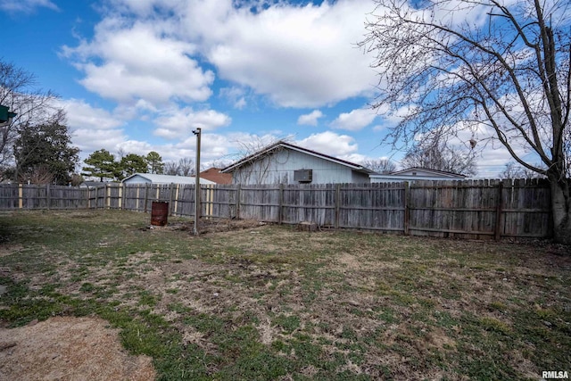 view of yard with a fenced backyard