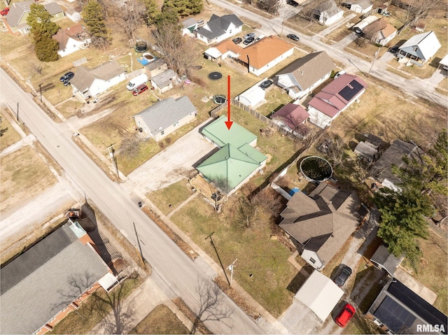 birds eye view of property with a residential view