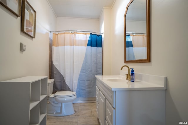 full bath with ornamental molding, curtained shower, vanity, and toilet