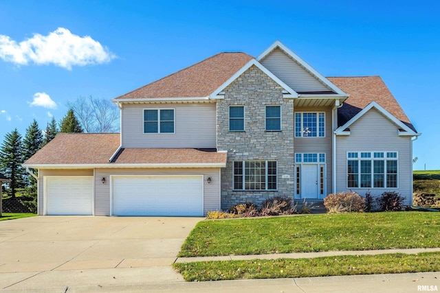 view of front of property featuring concrete driveway, roof with shingles, stone siding, and a front yard