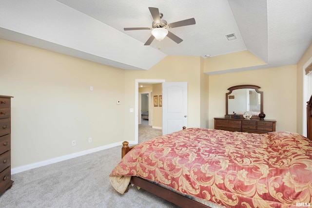 bedroom with baseboards, visible vents, light colored carpet, vaulted ceiling, and a textured ceiling