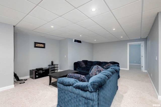 living room featuring carpet, baseboards, and recessed lighting